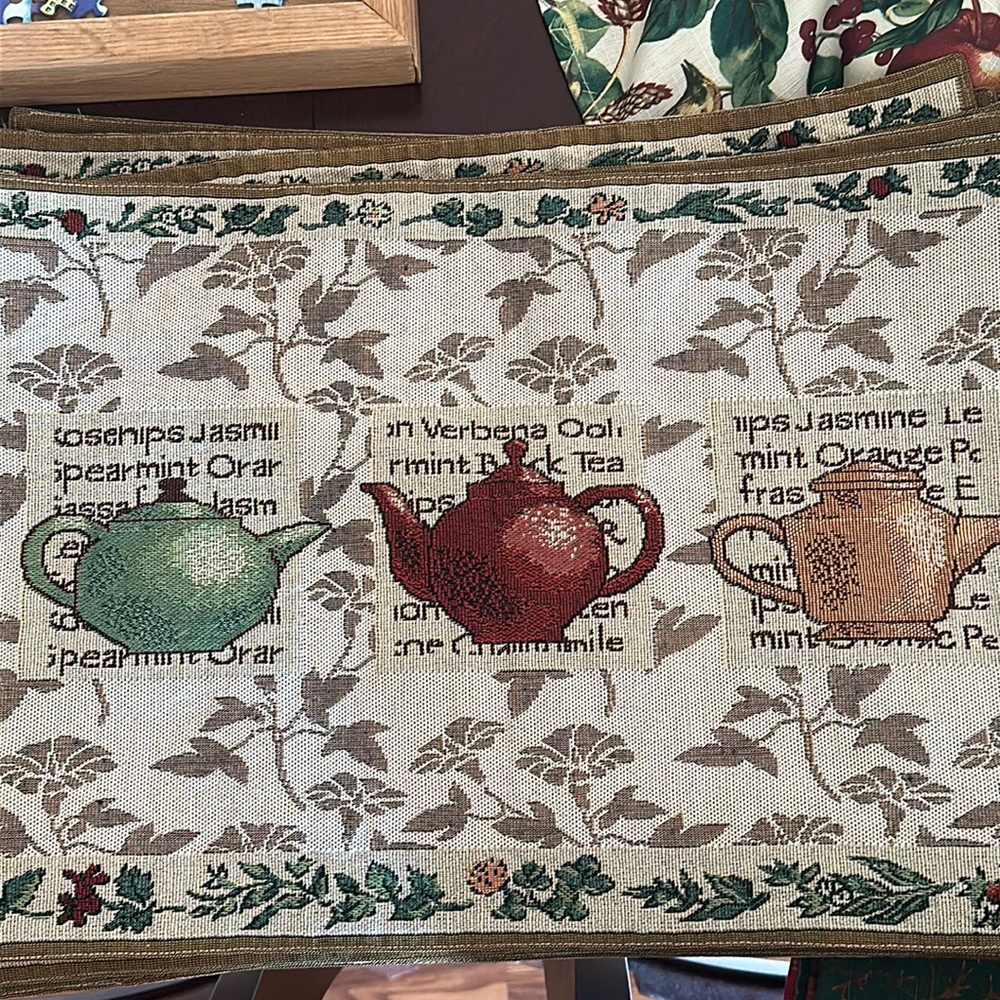 8 Floral with Teapots Fabric Placemats made by At Home. All in good condition.